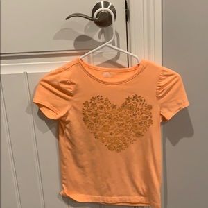 A orange heart shirt